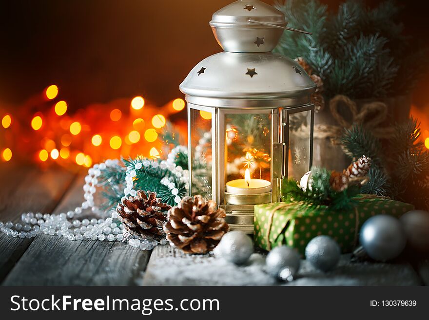 Merry Christmas and happy New year. Christmas gift and Christmas tree on dark wooden background. Selective focus.
