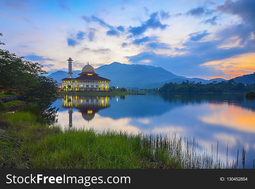 Mirror Reflection Of Beautiful Mosque During Sunrise.