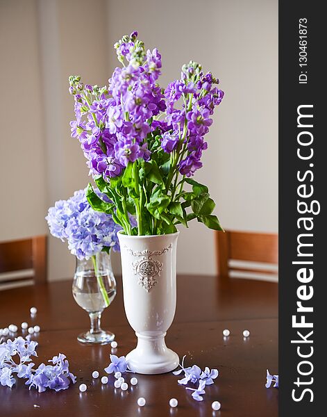 floral arrangement for interior decoration, table setting for a wedding or to create a home cosiness. use as background. lilac hydrangea