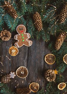 Gingerbread Men Laying On Wood Background. Christmas Or New Year Composition. Royalty Free Stock Image