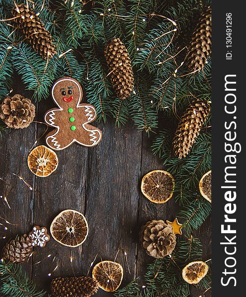 Gingerbread men laying on wood background. Christmas or New Year composition. copy space. Christmas or New Year composition. Christmas card