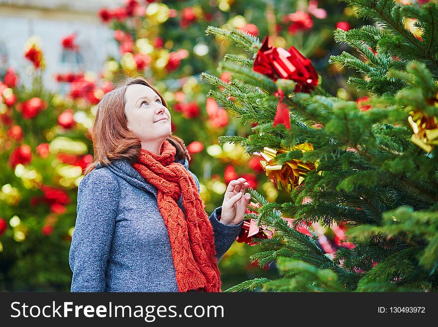 Pregnant Woman In Winter Clothes Near Christmas Tree