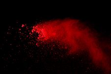 Abstract Red Powder Splatted Background,Freeze Motion Of Red Powder Exploding/throwing Green Dust. Royalty Free Stock Photo