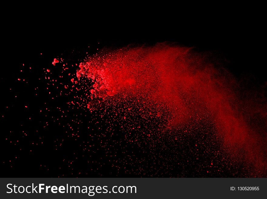 Abstract Red powder splatted background,Freeze motion of red powder exploding/throwing green dust.