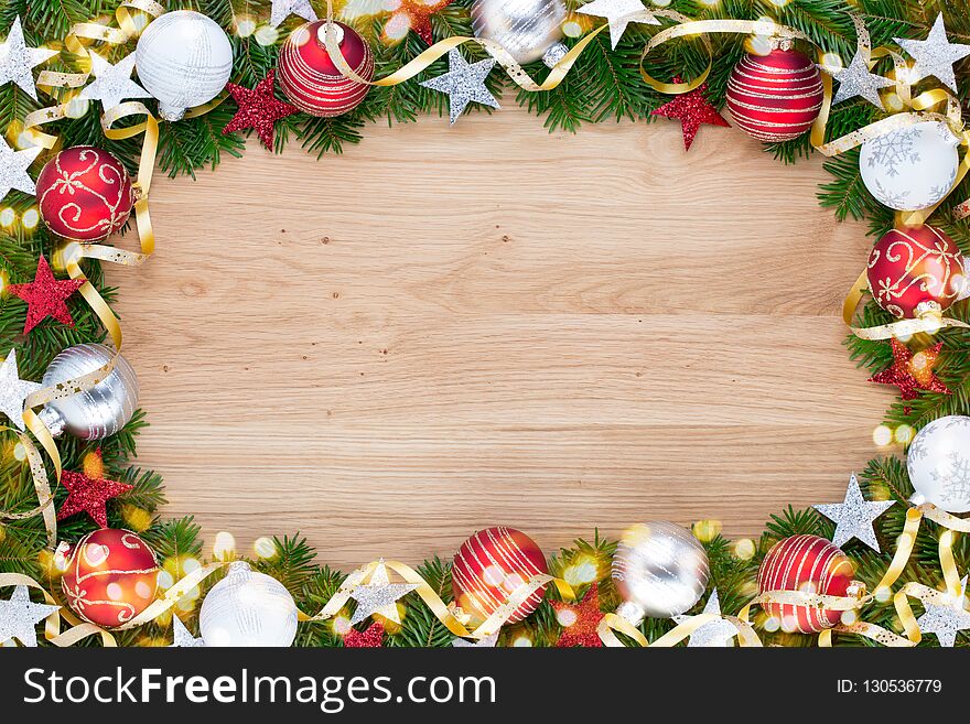 Christmas greeting card. Festive decoration on wooden background. New Year concept. Copy space. Flat lay. Top view. Christmas greeting card. Festive decoration on wooden background. New Year concept. Copy space. Flat lay. Top view.