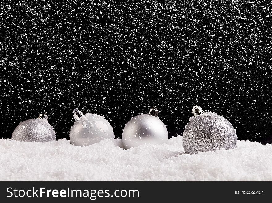 Christmas concept. Minimalistic background with baubles and snow. Christmas concept. Minimalistic background with baubles and snow