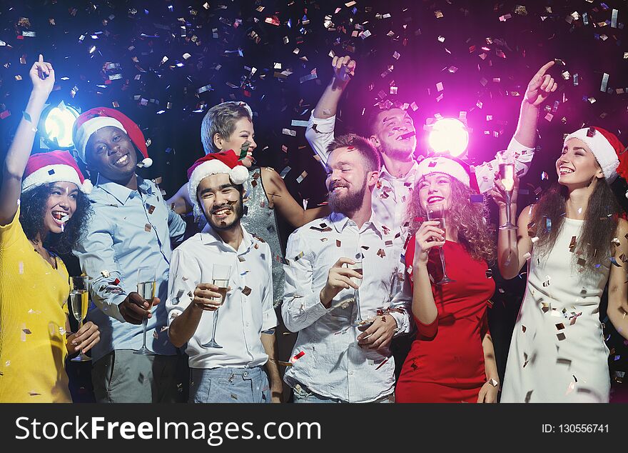 Happy Friends Dancing At New Year Party