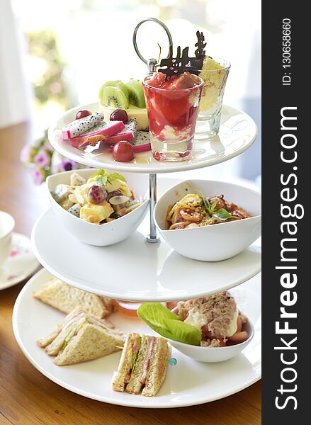 Afternoon tea set on table with tea pot