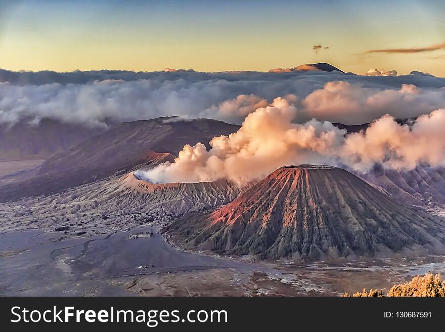 Mount Bromo sunrise with crater and cloudy misty morning view in high resolution image. Mount Bromo sunrise with crater and cloudy misty morning view in high resolution image