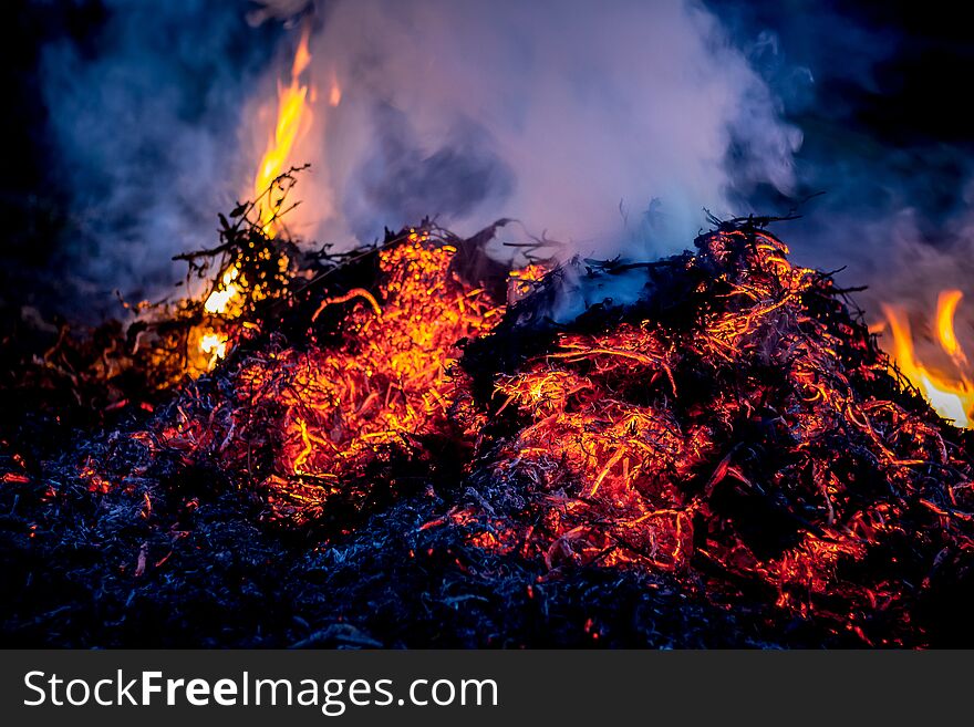 Fire and smoke during burning garbage. Pollution of the environment