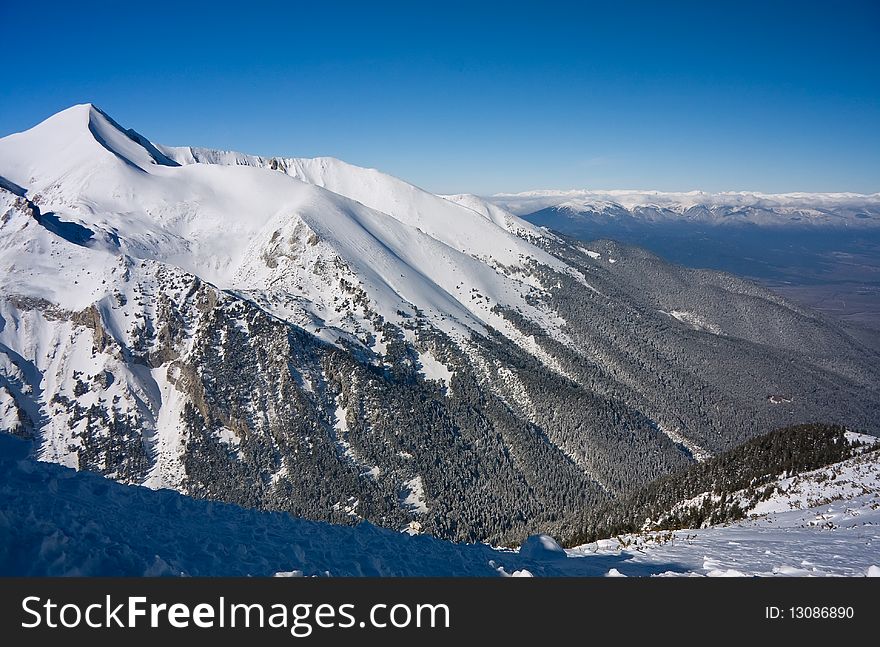Panorama of winter mountains. Alpine ski resort Bansko, Bulgaria. Panorama of winter mountains. Alpine ski resort Bansko, Bulgaria