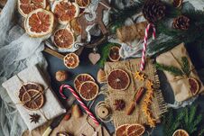 Christmas Or New Year Composition With Handmade Gifts, Dry Oranges, Cinnamon, Fir Tree On Dark Stone Table. Holidays Preparations, Royalty Free Stock Images
