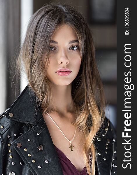 Beautiful, young girl in a fashionable dress in Marsala and leather jacket. The girl in the restaurant. Trend clothing. Without filters. Natural color. Beautiful, young girl in a fashionable dress in Marsala and leather jacket. The girl in the restaurant. Trend clothing. Without filters. Natural color.