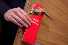 Do Not Disturb Sign Hanging On The Door Royalty Free Stock Photo