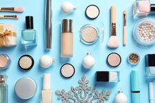 Flat Lay Composition With Makeup Products And Christmas Decor Stock Images