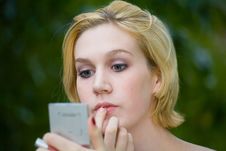 Beautiful Yong Blonde Girl With Blue Eyes Putting On Makeup Royalty Free Stock Photos Beautiful Yong Blonde Girl With Blue Eyes Putting On Makeup Royalty Free Stock Photos
