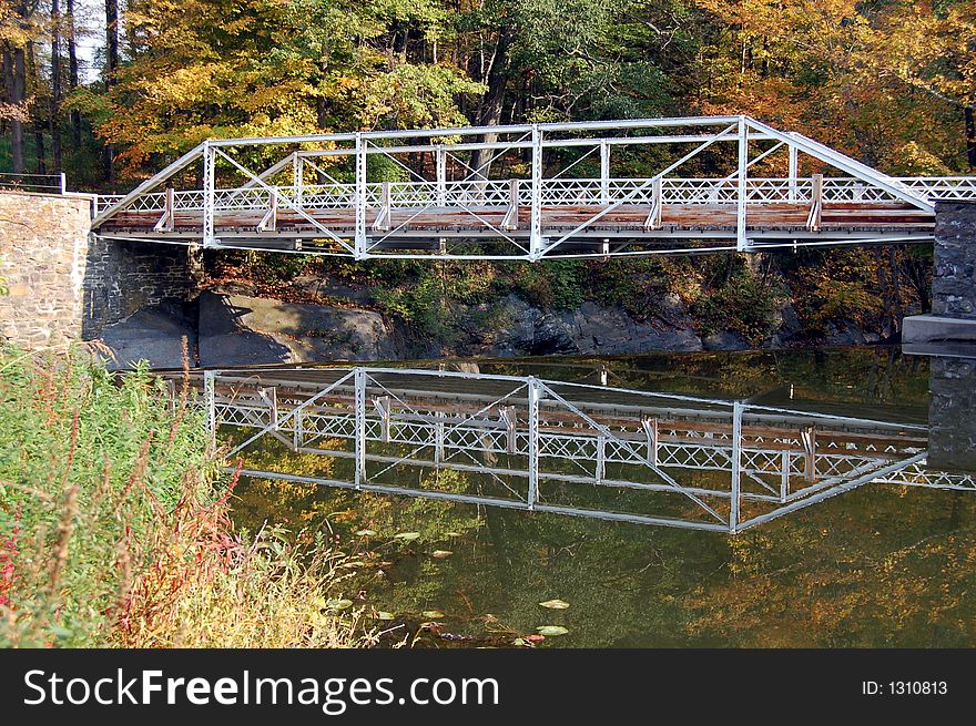 Reflection of bridge in water. Reflection of bridge in water.