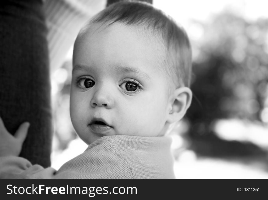 Adorable little boy playing in a park. Adorable little boy playing in a park