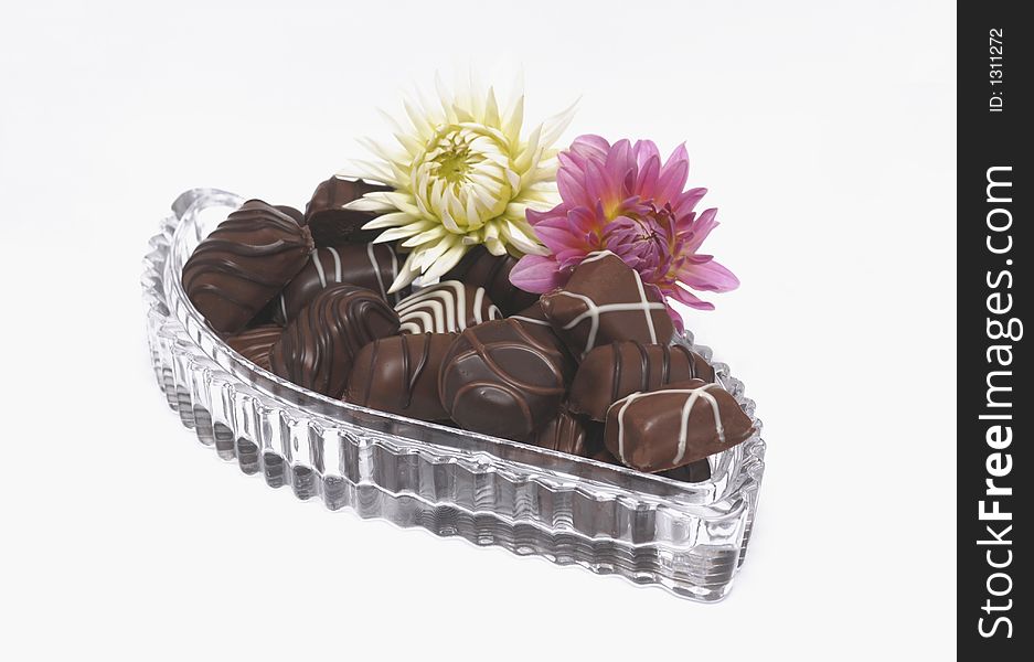 Chocolates in a christal dish with flowers