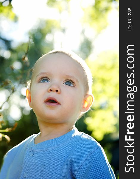 Adorable little boy playing in a park. Adorable little boy playing in a park