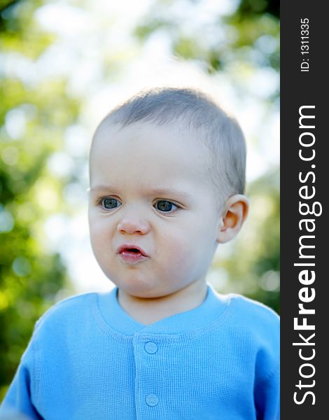 Adorable little boy playing in a park. Adorable little boy playing in a park