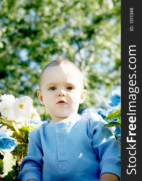 Adorable little boy playing in a park. Adorable little boy playing in a park