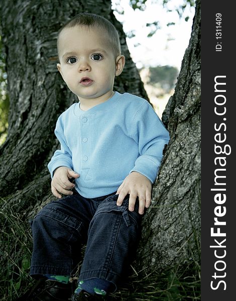 Adorable little boy playing in a park. Adorable little boy playing in a park