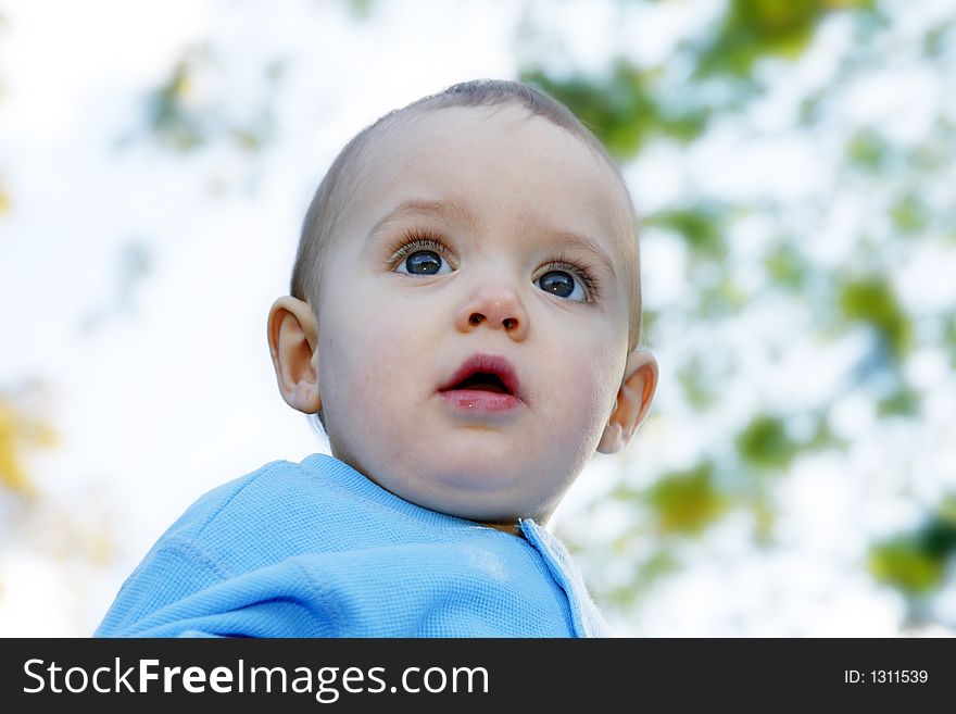 Adorable little boy playing in a park. Adorable little boy playing in a park