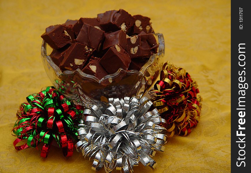Photo of chocolate almond fudge and Xmas bows. Photo of chocolate almond fudge and Xmas bows.