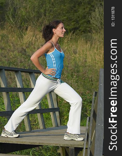 Young healthy woman exercising outdoor