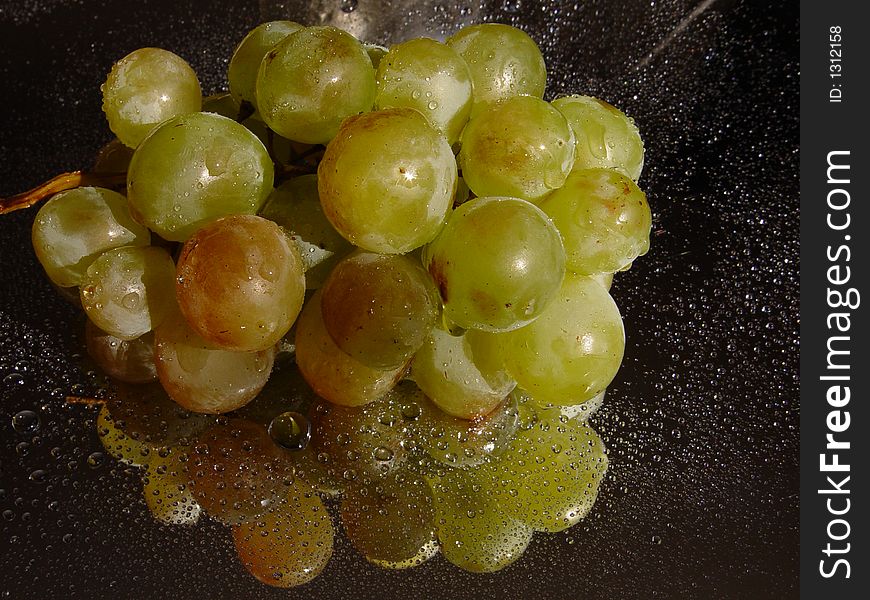 Grape with water drops on it