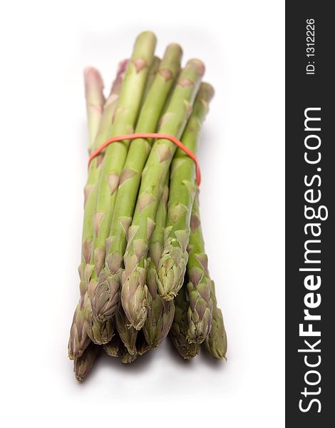 Asparagus spears on a white studio background. Asparagus spears on a white studio background.