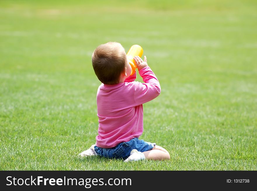 Happy baby on green grass. Happy baby on green grass