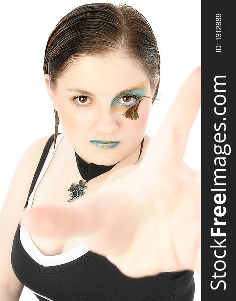 Beautiful 15 year old girl in face art. Hand reaching out for camera. Beautiful 15 year old girl in face art. Hand reaching out for camera.