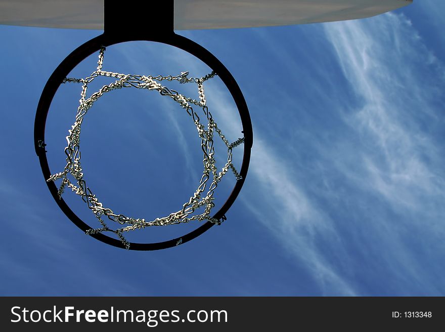 Looking upward thru a basketball hoop and the net is made of chain (instead of rope). Looking upward thru a basketball hoop and the net is made of chain (instead of rope)