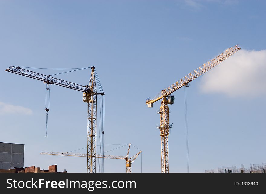 The two cranes build construction. The two cranes build construction