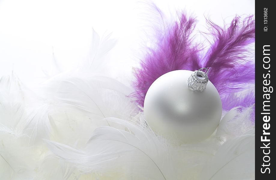 Christmas decoration on white feathers. Christmas decoration on white feathers