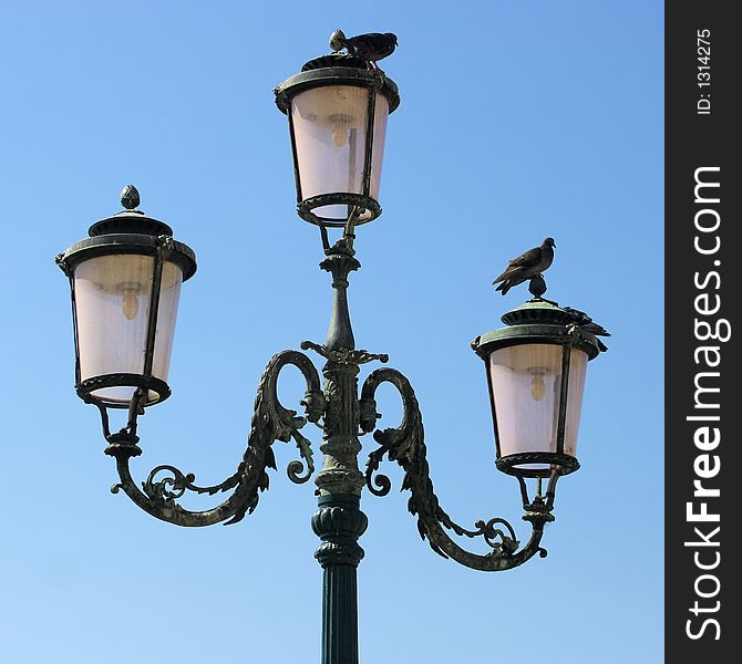 Lamppost and pigeons.
