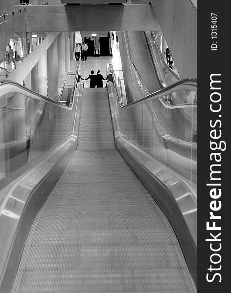 Escalators at Suvarnabhumi Airport in Bangkok, Thailand. Shallow depth of field. Escalators at Suvarnabhumi Airport in Bangkok, Thailand. Shallow depth of field.