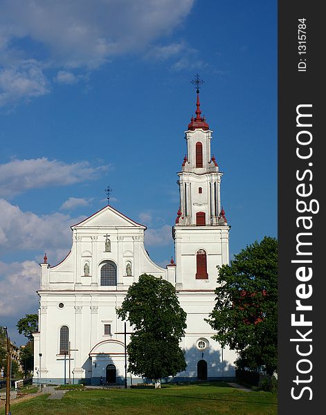Catholic cathedral on sky background, frontal view