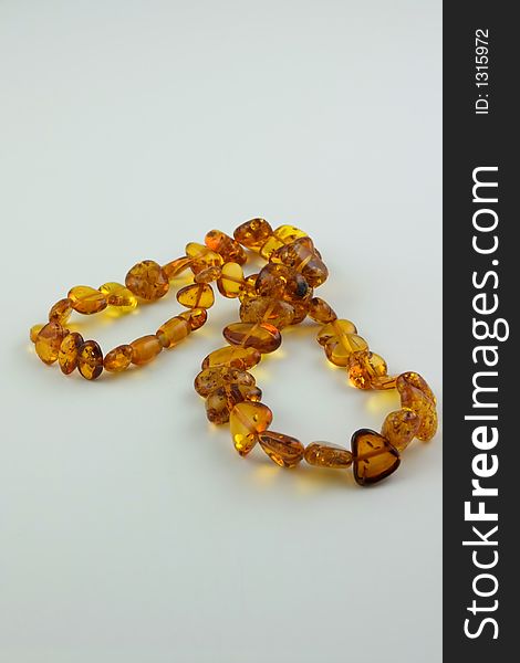 Luxury amber necklace isolated on white background