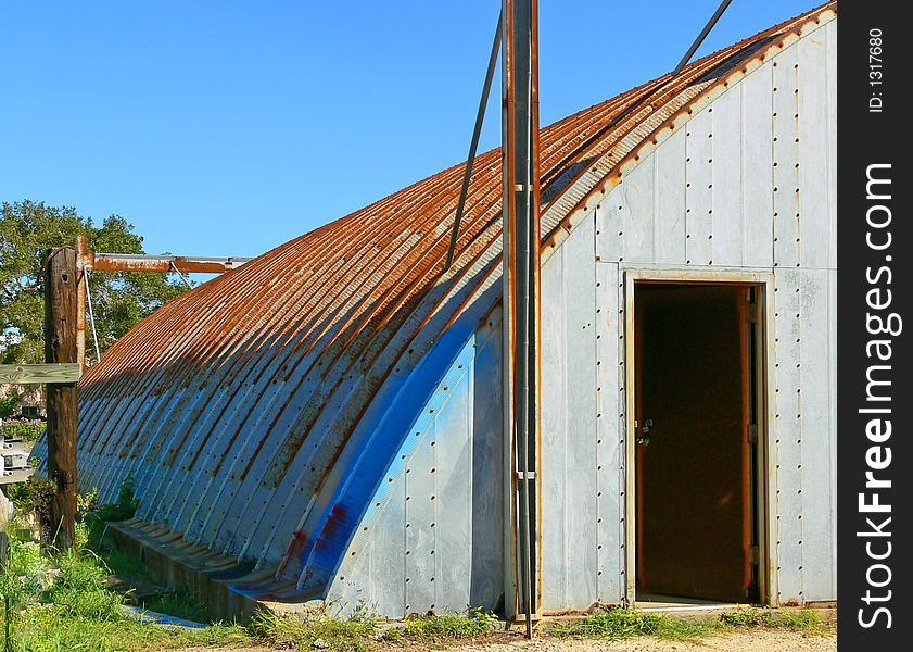 Painted rusted dome shed Galveston Texas