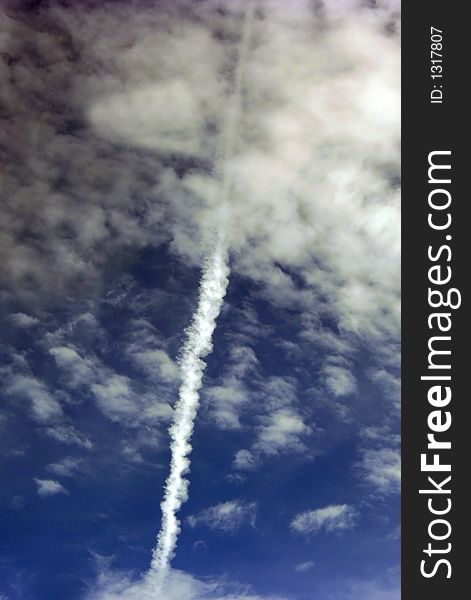 A jet trail in the blue sky
