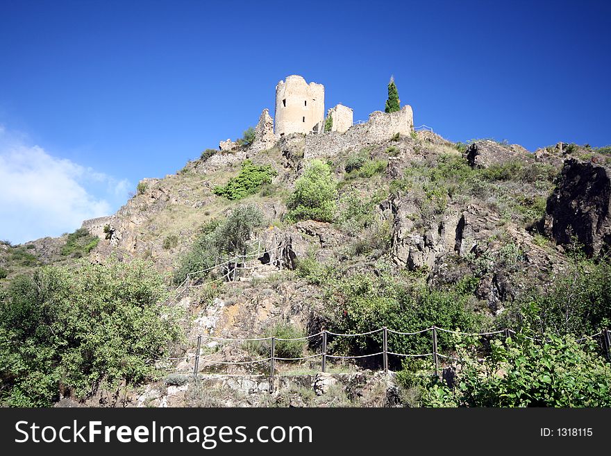 Fortified castle ruins on a crest