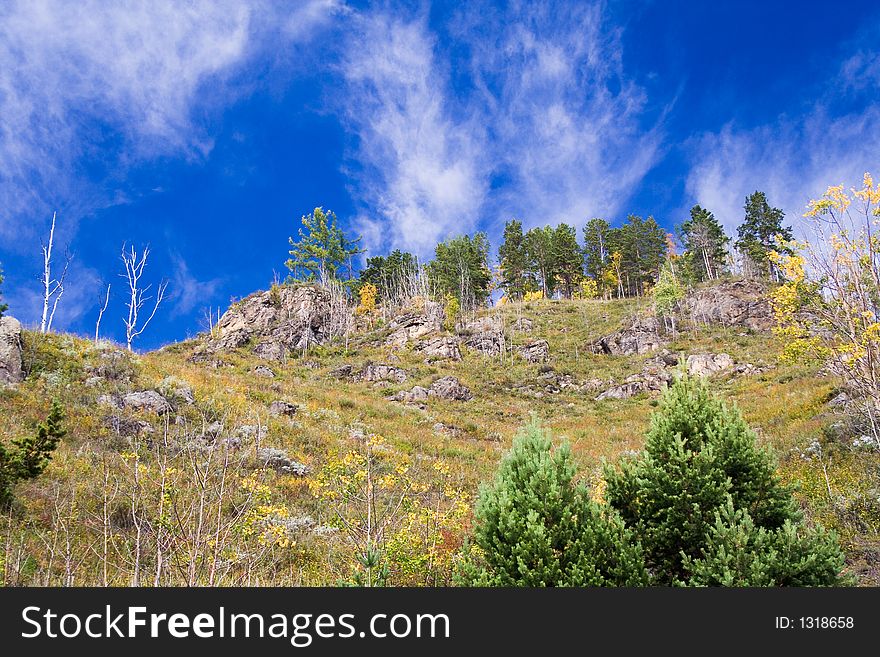 Colourful autumn view of a stony hill. Colourful autumn view of a stony hill