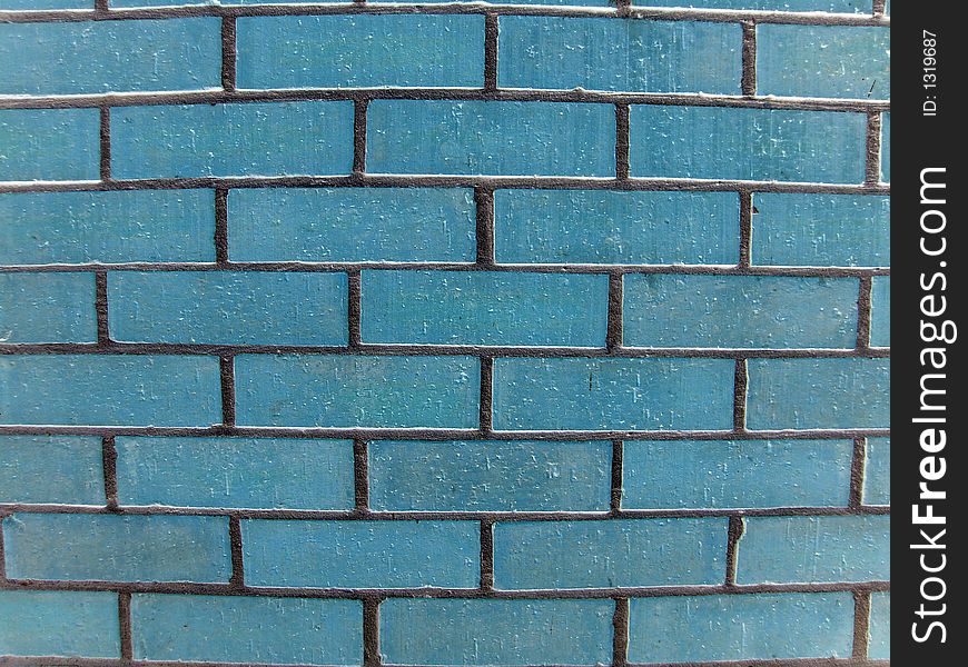 Blue brick wall with grey mortar