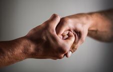 Male Hand United In Handshake. Man Help Hands, Guardianship, Protection. Two Hands, Arm, Helping Hand Of A Stock Images