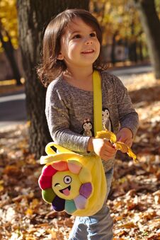 Beautiful Smiling Little Girl In Autumn Park Royalty Free Stock Images