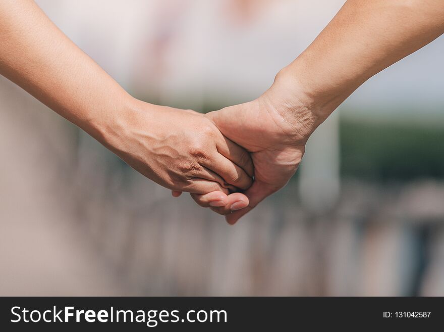 Couple holding hands.selective focus.