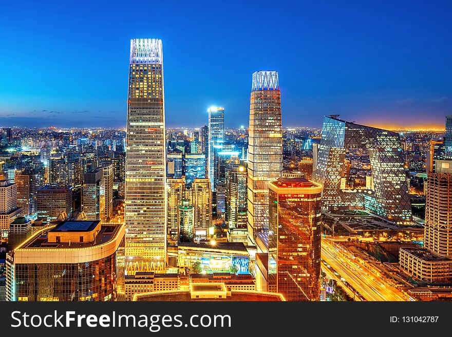 High-rise buildings and viaducts in the financial district of the city, night view of Beijing, China. High-rise buildings and viaducts in the financial district of the city, night view of Beijing, China.